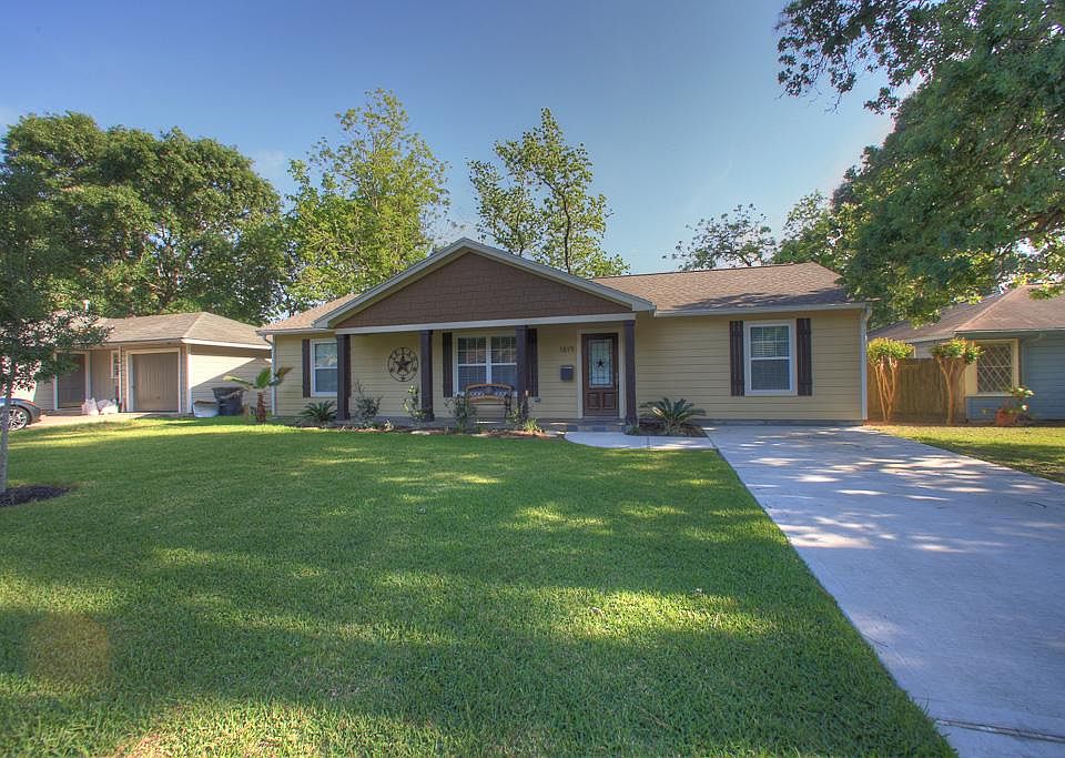 Clean landscaping accents this recently remodeled home in booming Oak Forest.