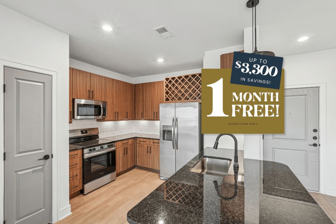 Kitchen with Granite Countertop and Stainless Steel Appliances
