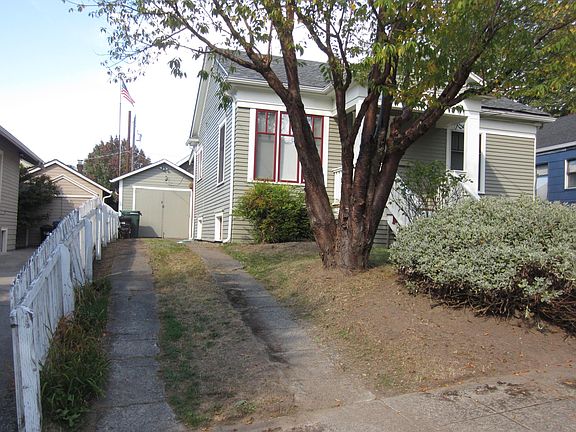 Off-street driveway with spacious shed for added storage.