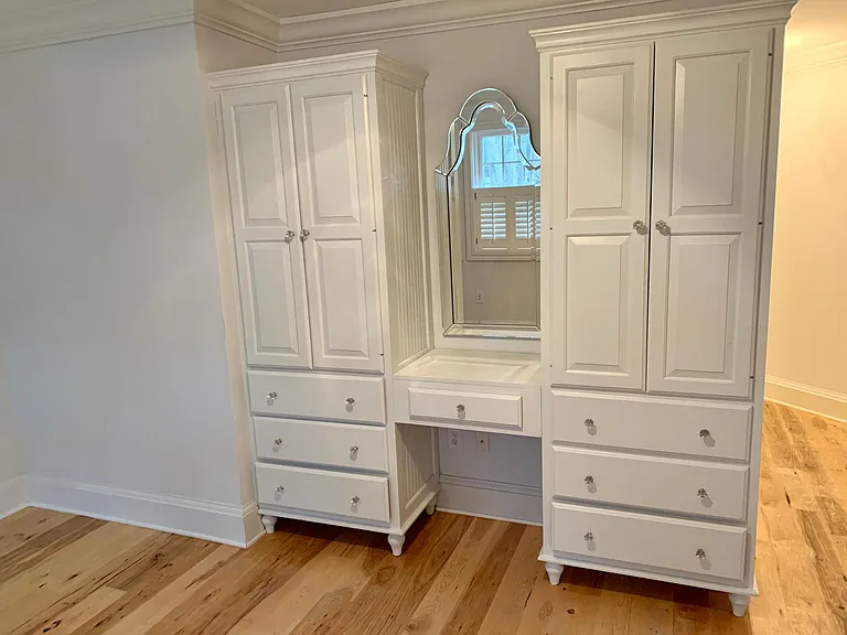 Built in dresser and storage area in owners suite.