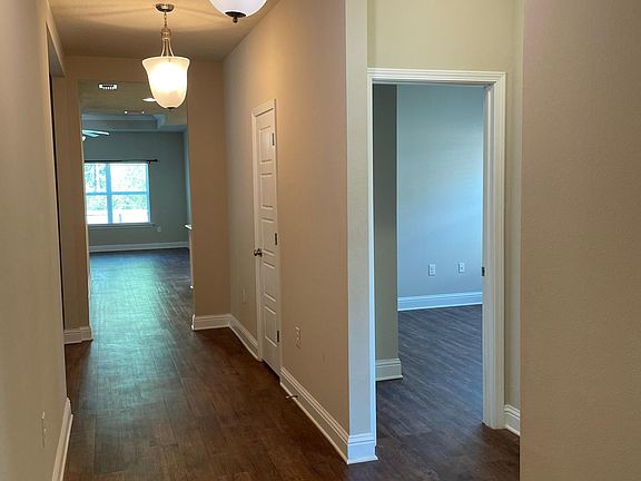 Entry - 9 ft ceilings throughout house. Two Bedrooms and Guest Bath to right. Third Bedroom and Laundry to the Left