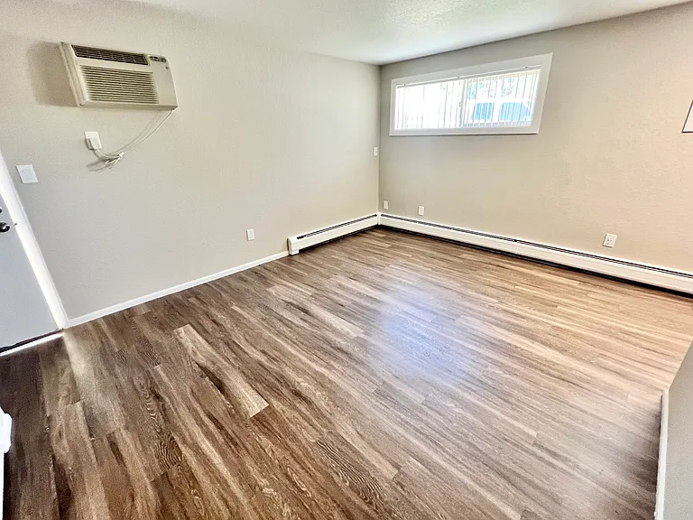Explore this inviting living area, bathed in natural light with sleek wood floors. Explore this inviting living area, bathed in natural light with sleek wood floors.