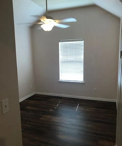 Wood floors and custom fans in each of the 3 spacious bedrooms.