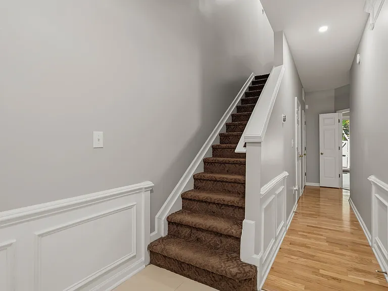 Steps leading upstairs to 2nd floor and hallway to office/bedroom #3