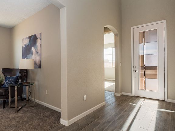 Front door features beautiful glass detailing.