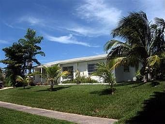 Exterior with no HOA and large tree lined lot 