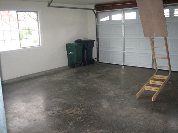 2 car garage   stairs to a lot of extra storage in the roof