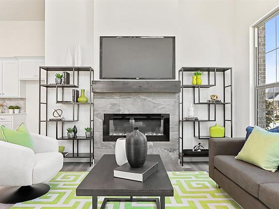 Cozy living room feaurturing beautiful firplace- the perfect place to relax.