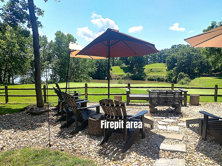 Firepit area with lake and golf course view