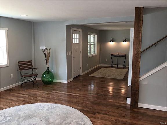 Step inside, and you'll walk into the light and bright living room and den.  All new flooring throughout, fresh paint.