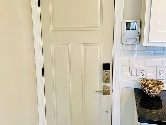 Apartment door in reinforced steel with heavy deadbolt. Keypad entry so you are never locked out.