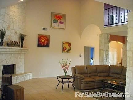 living area with 19' ceilings & rock pillars