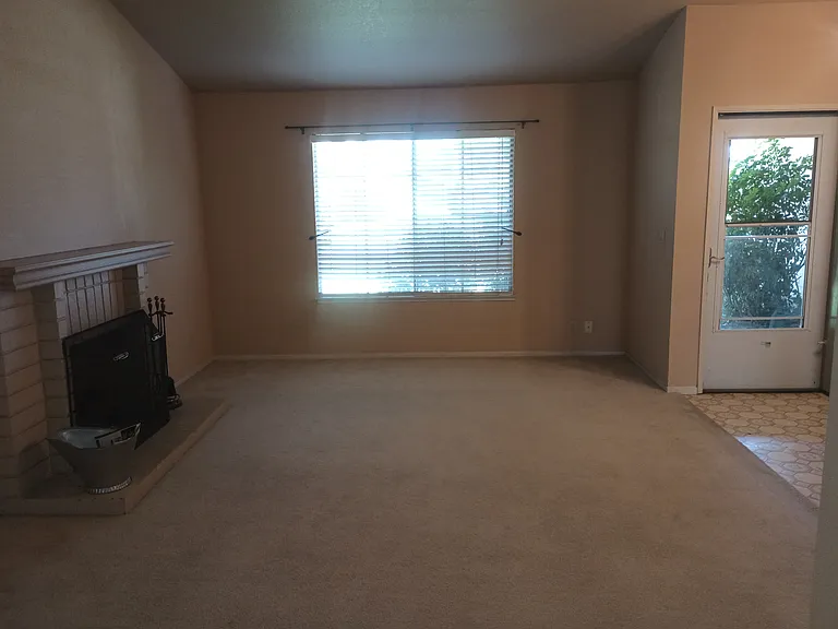 Living room, front door entry with storm door