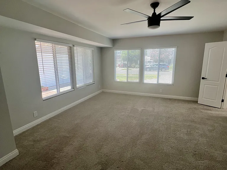 Expanded main bedroom with many windows