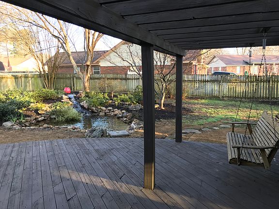 deck with swing and arbor
