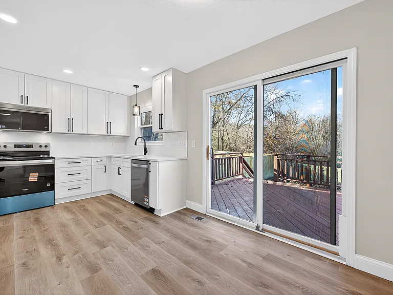 Kitchen with modern cabinetry and ample lighting