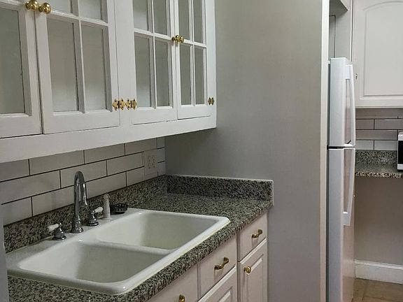 Granite countertops and subway tile backsplash