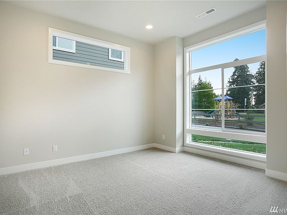 Main Floor bedroom. Photos of 3014 plan on another lot. Color details will vary.