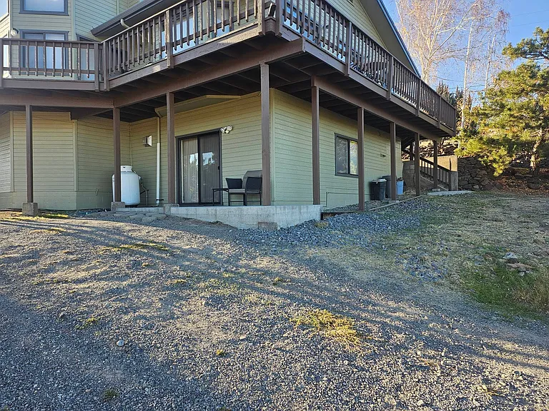 View from parking area to apartment and patio