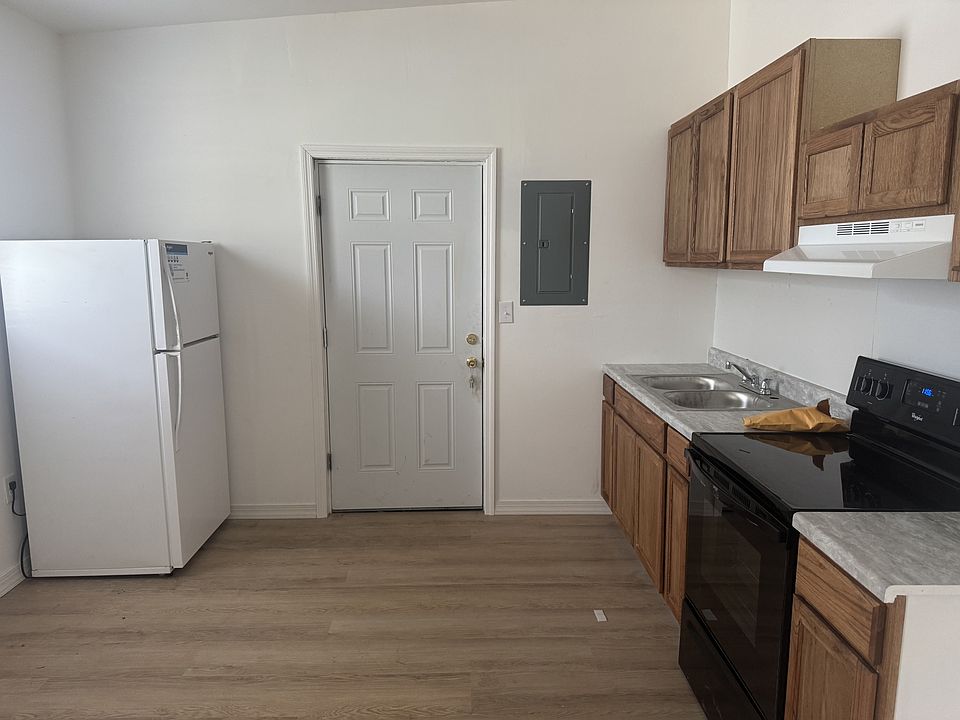 View of the Kitchen, includes Range, stove, refrigerator, plenty of storage space!