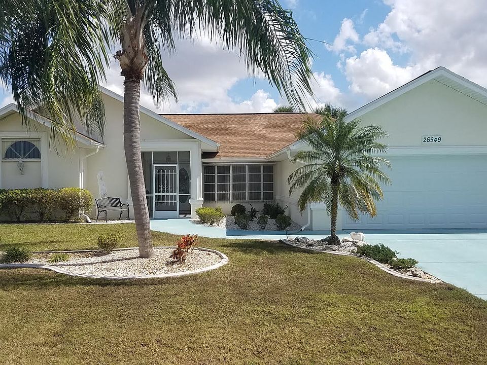 Front View of Home W/ Palms!