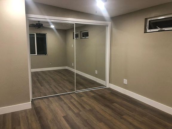Bedroom w/lighted closet and organizer.