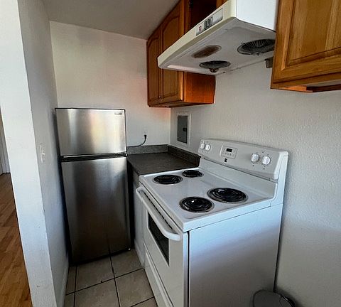 Kitchen with new stove and new refrigerator