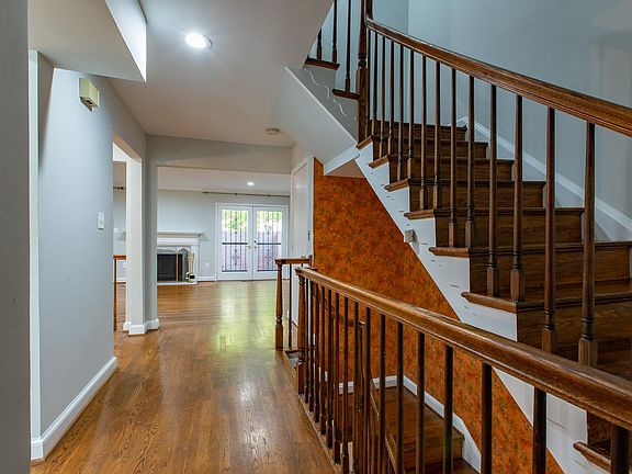 Hallway linking kitchen, half bath, dining room, living room
