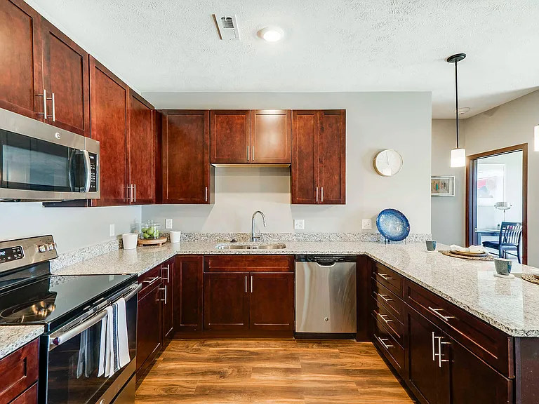 Our upscale kitchens feature modern hardware, granite countertops and stainless-steel appliances.