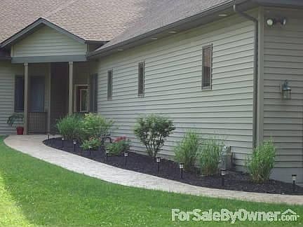 Inviting front entry to home! : Walk up to front door on winding stamped concrete walkway