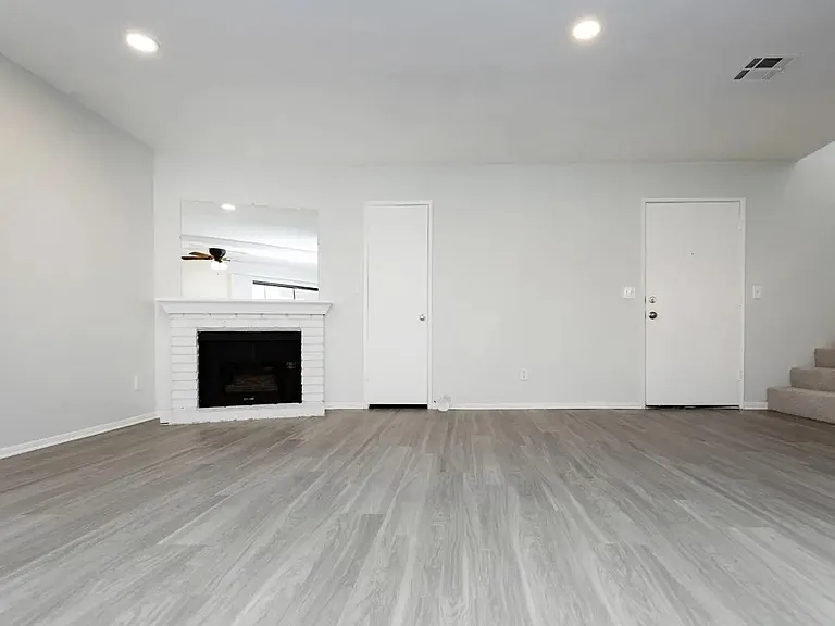 living area, decorative fire place, stairs to bedroom. units vary