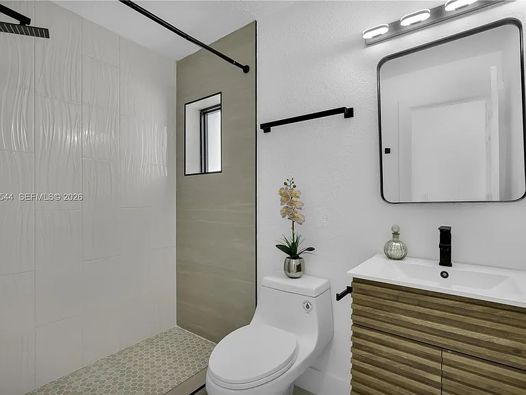 7501 Raleigh St — Photo 12