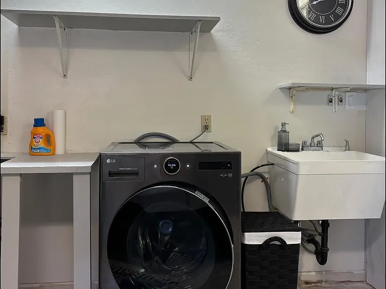 Dedicated LG WashCombo Washer & Dryer Located Adjacent to the Suite