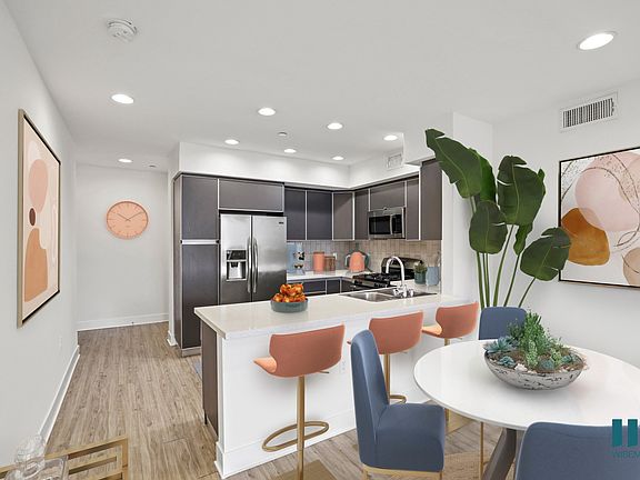Open-Concept Kitchen with Countertop Bar and Energy-Efficient Appliances