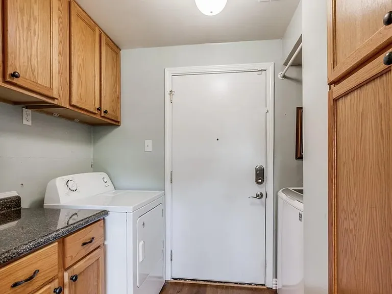 Utility room with laundry to garage access