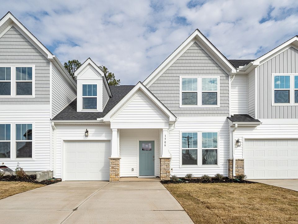 2 Story townhome, white and grey, 1 car garage