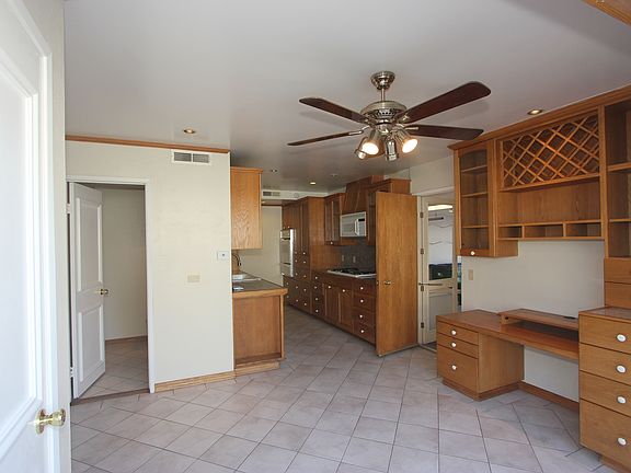 Dining and kitchen area with home office space