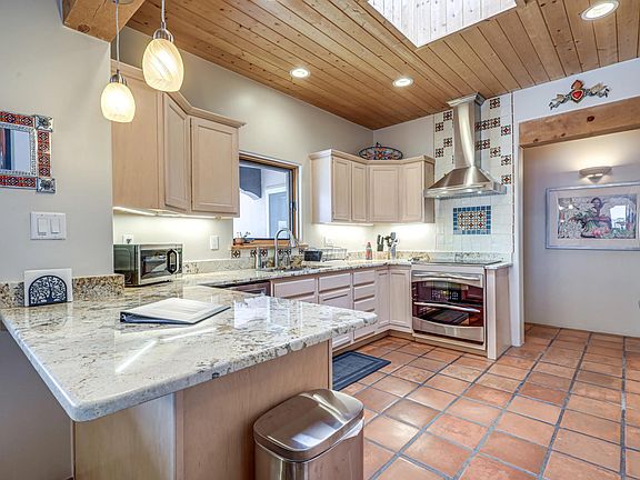 Updated kitchen with granite counter tops and custom tile work