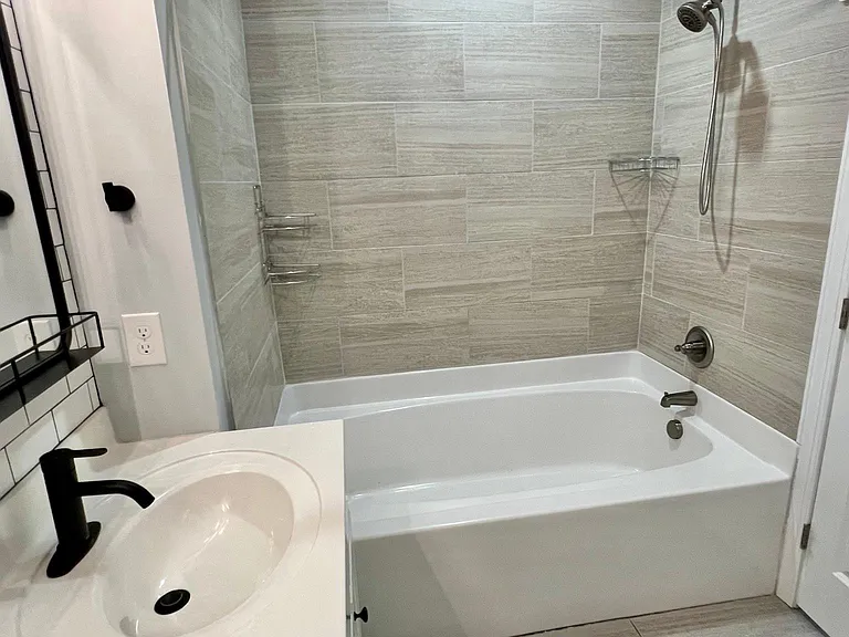 Upstairs master bedroom with walk-in closet and full bath featuring dual vanities.