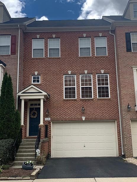 Front - 2 car garages additional parking on driveway