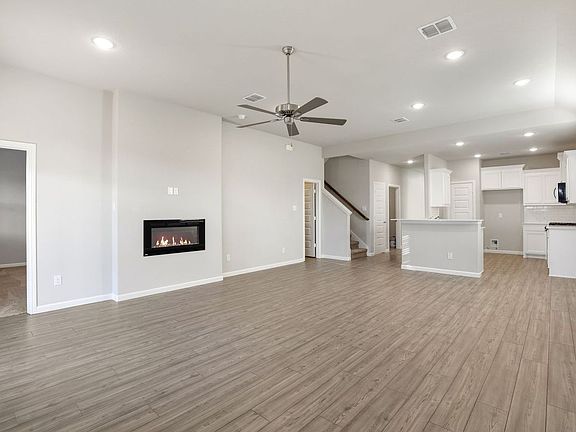 Living Room in the Sapphire home plan by Trophy Signature Homes - REPRESENTATIVE PHOTO