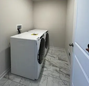 2nd Floor Laundry Room with Whirlpool Washer and Dryer