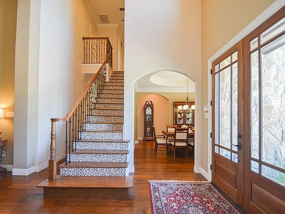 Another view of the foyer providing a glimpse of the Formal Dining Room just beyond. Here also is the staircase that leads to the second level of this 5 Bedroom, 3.5 Bath home.