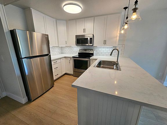Spacious kitchen with plenty of storage. Pantry & under-stair storage is behind the photographer in this photo. Front door to the left.