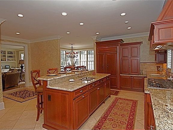 granite countertops w/ogee edging, travertine tile floors, butler's pantry