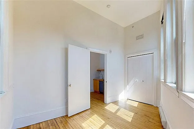 Bedroom, facing bedroom door and closet.