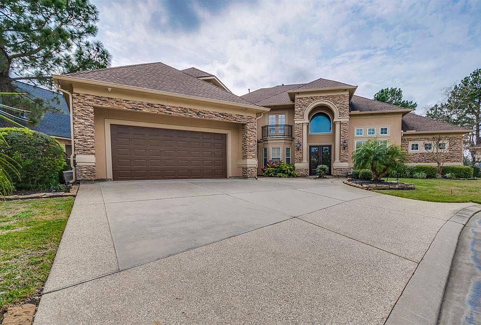 Welcome to 6215 Windrose Hollow, a magnificent custom home with exquisite craftsmanship with spectacular views of the Golf Course.