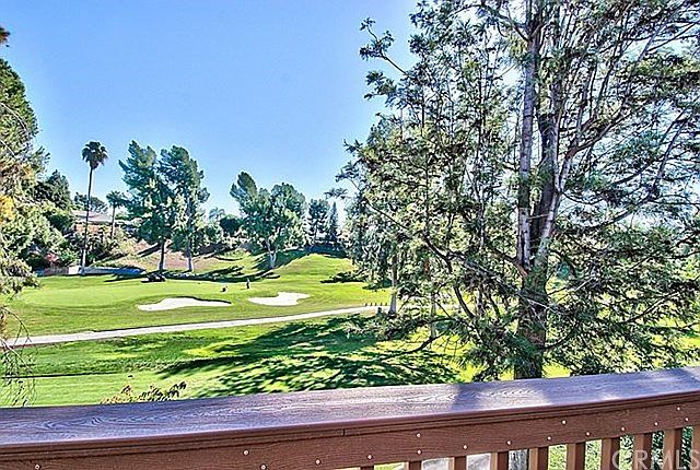 The 14th green & the 15th tee, right off the dining room terrace ~ enjoy the view!