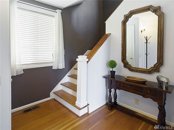 Step into warm and inviting entryway with fir floors and period details.