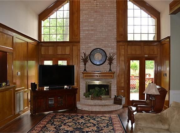 Den with Wood Laminate Floors.
